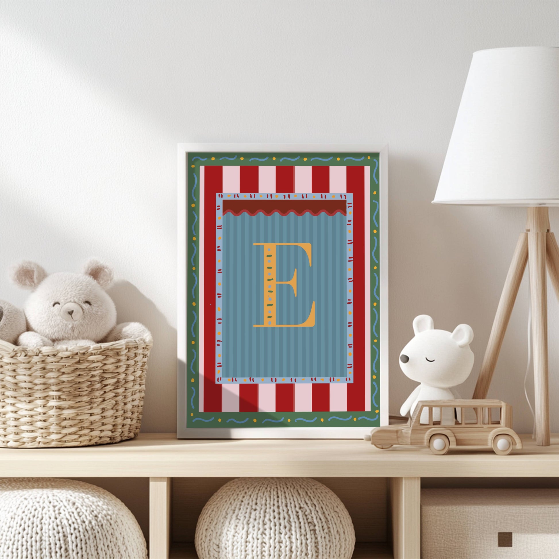 Framed alphabet wall art featuring the letter ‘B’ in yellow on a blue striped background with colorful decorative borders, perfect for nursery decor, kids and baby room styling, or unique alphabet print gift idea.