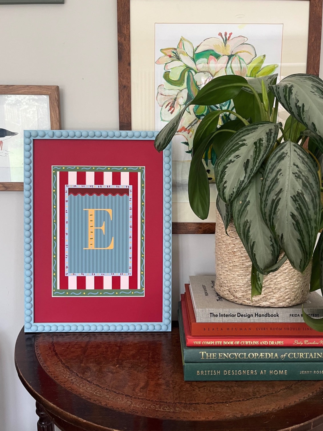Framed alphabet wall art featuring the letter ‘B’ in yellow on a blue striped background with colorful decorative borders, perfect for nursery decor, kids and baby room styling, or unique alphabet print gift idea.