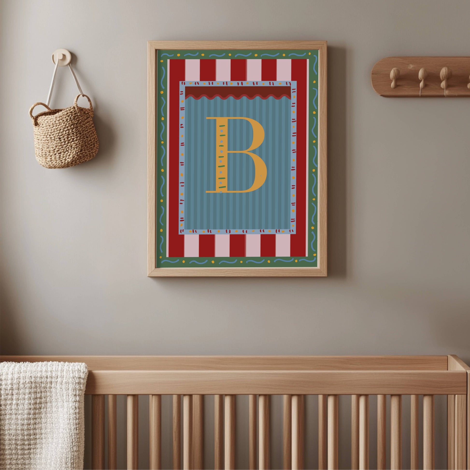 Framed alphabet wall art featuring the letter ‘B’ in yellow on a blue striped background with colorful decorative borders, perfect for nursery decor, kids and baby room styling, or unique alphabet print gift idea.
