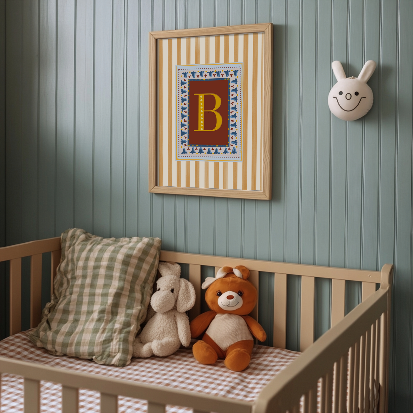 Decorative and unique alphabet wall art featuring your chosen letter in a bold yellow font on a deep red background, framed with a floral block-print style border and set against vertical muted yellow stripes—ideal for playful nursery decor, alphabet print collections, and unique gift ideas for children’s playrooms and nursery decor as well as design lovers